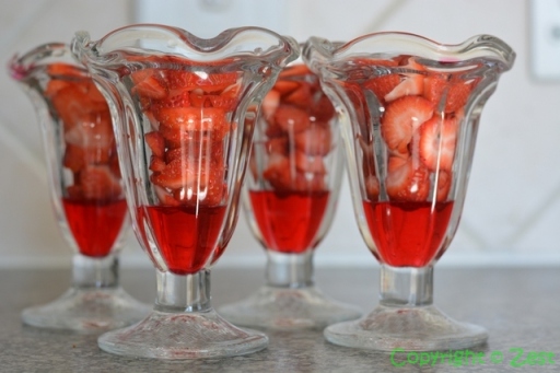 Fresh strawberries form the next layer of the dessert